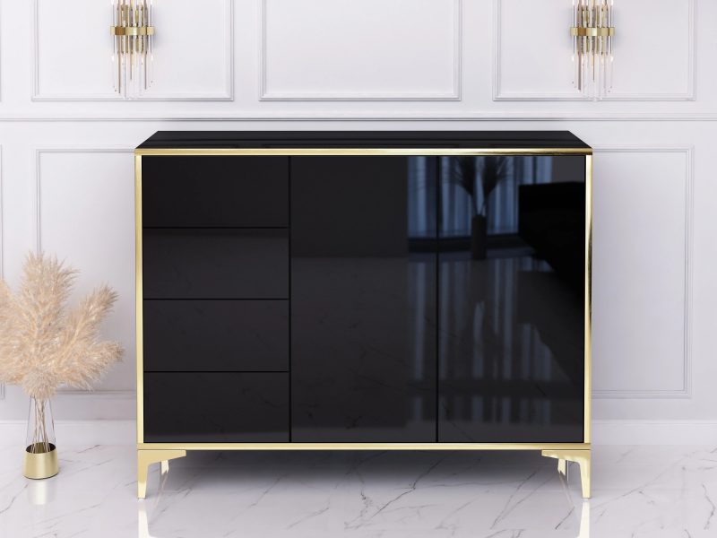 Kommode Monako 118cm Schwarz Hochglanz mit goldenen Akzenten im modernen Wohnzimmer.