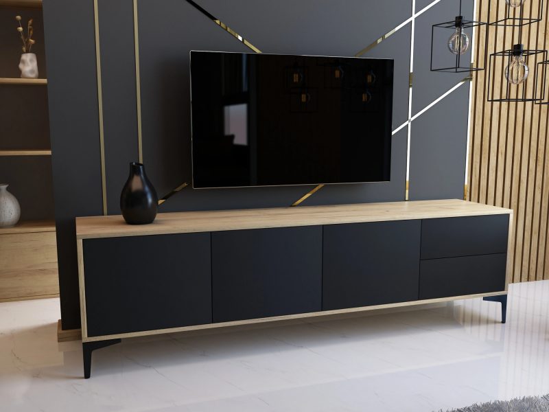 Modernes TV-Lowboard Monako 180cm Schwarz Matt mit Eiche Craft Gold in Wohnzimmer mit Fernseher.