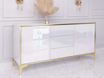 Seitenansicht der Kommode Monako mit Hochglanzfront und goldenen Beinen auf Marmorboden